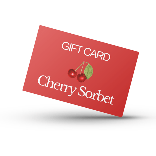 Red card with the words "gift card" and "cherry sorbet" printed on them and an illustration of some cherries